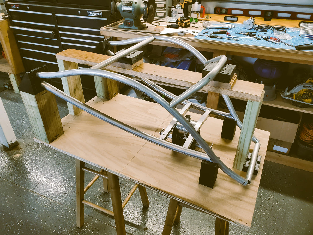 An early welded Bera Buggy frame prototype on sawhorses in the garage workshop