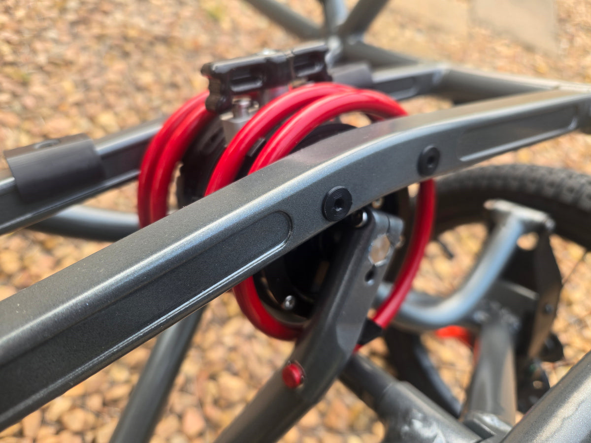 Close-up of the red-coil hydraulic damper on the Bera Buggy frame
